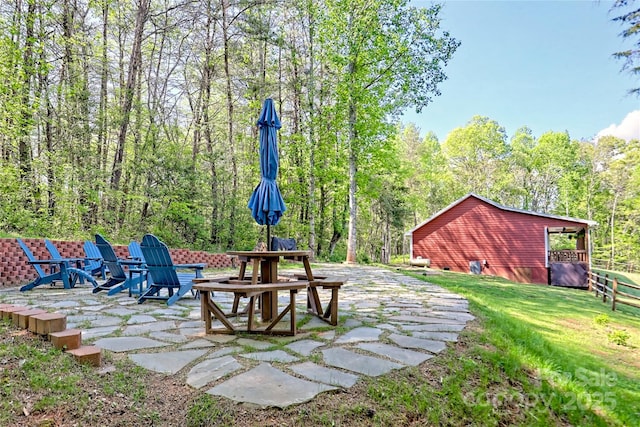202 Wild Pear Ln Unit 3 & 7A, Franklin, NC 28734 - view of green lawn with a patio, a fire pit, and a wooded view