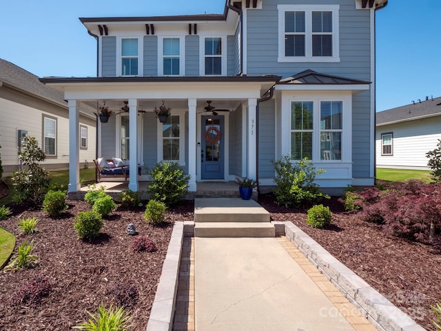italianate house with a standing seam roof, covered porch, ceiling fan, and metal roof