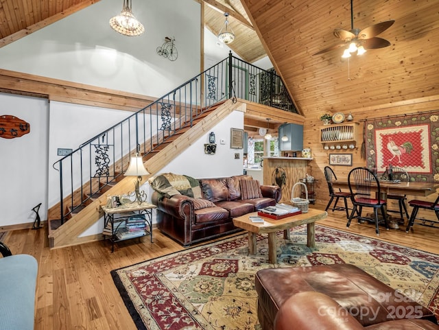 480 River Crest Parkway, Rutherfordton, NC 28139 - living room featuring wood-type flooring, high vaulted ceiling, ceiling fan with notable chandelier, wood ceiling, and stairway