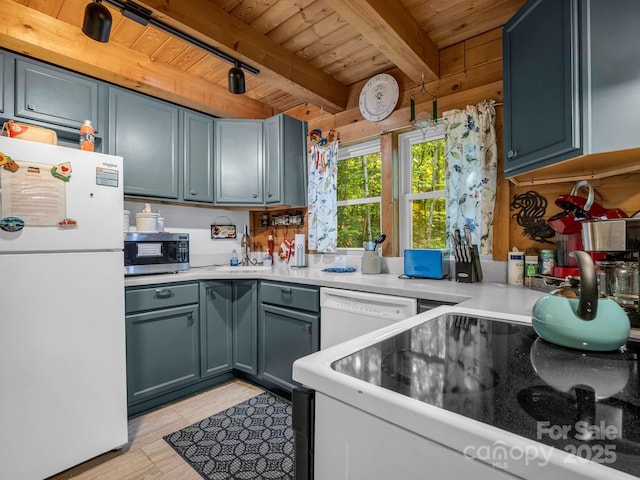 480 River Crest Parkway, Rutherfordton, NC 28139 - kitchen with white appliances, beamed ceiling, light countertops, wooden ceiling, and a sink