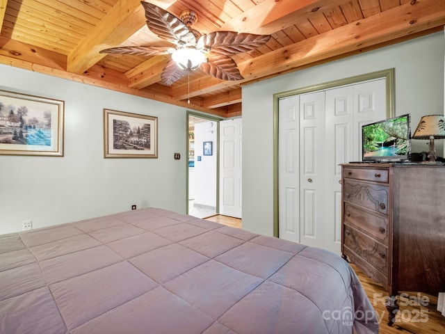480 River Crest Parkway, Rutherfordton, NC 28139 - bedroom featuring a closet, wood finished floors, beam ceiling, wooden ceiling, and a ceiling fan