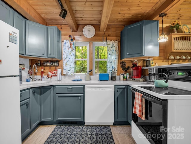 480 River Crest Parkway, Rutherfordton, NC 28139 - kitchen featuring white appliances, beamed ceiling, light wood-style floors, wood ceiling, and a sink