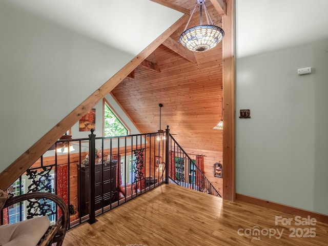 480 River Crest Parkway, Rutherfordton, NC 28139 - bonus room featuring an inviting chandelier, wood finished floors, baseboards, wooden walls, and high vaulted ceiling