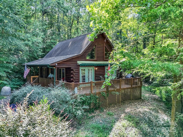 480 River Crest Parkway, Rutherfordton, NC 28139 - exterior space with a deck, roof with shingles, french doors, log siding, and a forest view