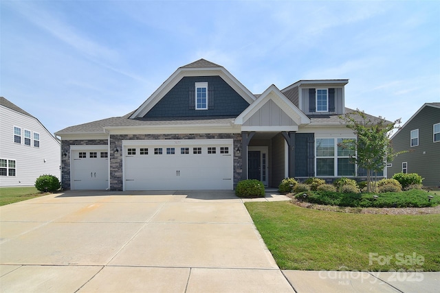 3073 Oliver Stanley Trl, Lancaster, SC 29720 - craftsman inspired home with board and batten siding, a front yard, concrete driveway, an attached garage, and stone siding