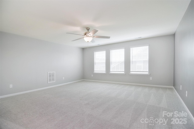 3073 Oliver Stanley Trl, Lancaster, SC 29720 - empty room with a ceiling fan, light colored carpet, visible vents, and baseboards