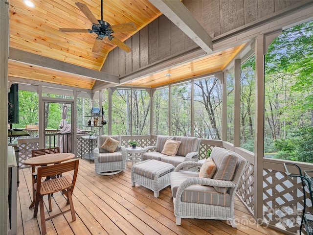 sunroom / solarium with ceiling fan and outdoor lounge area