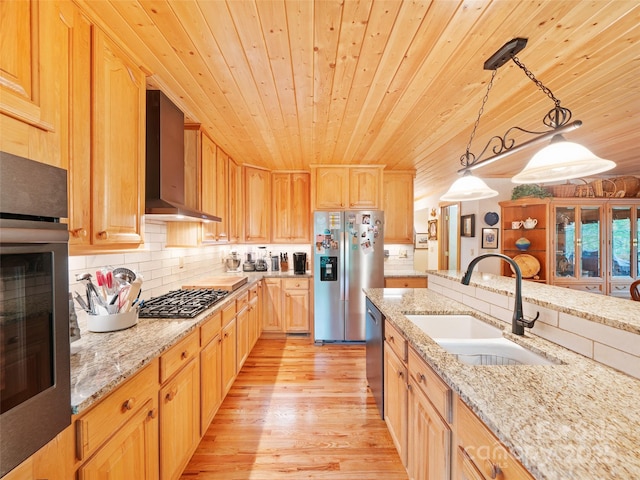 kitchen featuring a sink, wall chimney exhaust hood, stainless steel appliances, decorative backsplash, and wooden ceiling