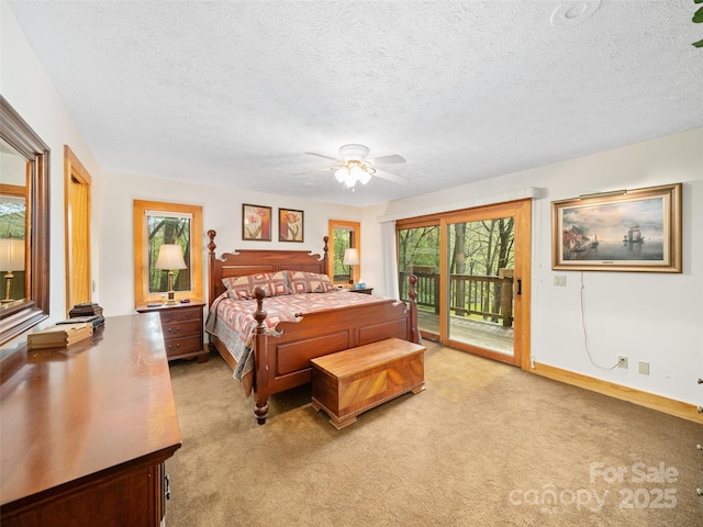 bedroom featuring access to outside, light carpet, and multiple windows