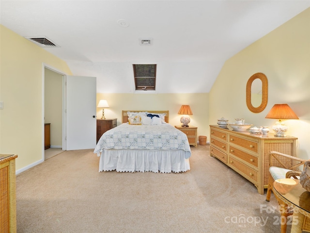 bedroom with light carpet, vaulted ceiling, and visible vents