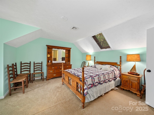 bedroom featuring carpet flooring, lofted ceiling, and visible vents