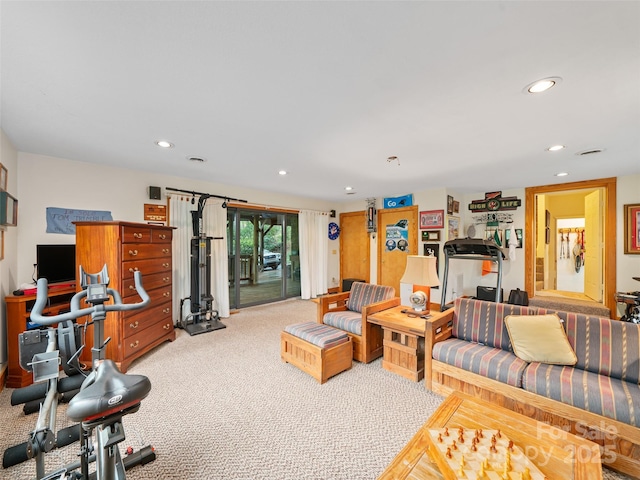 living area featuring carpet flooring and recessed lighting