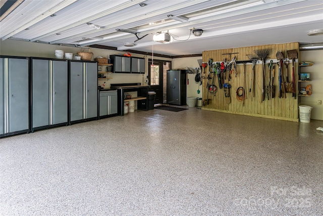 69 Forest Rd, Asheville, NC 28803 - garage with a garage door opener and wooden walls