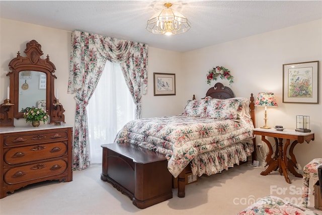 69 Forest Rd, Asheville, NC 28803 - bedroom featuring carpet flooring and a chandelier