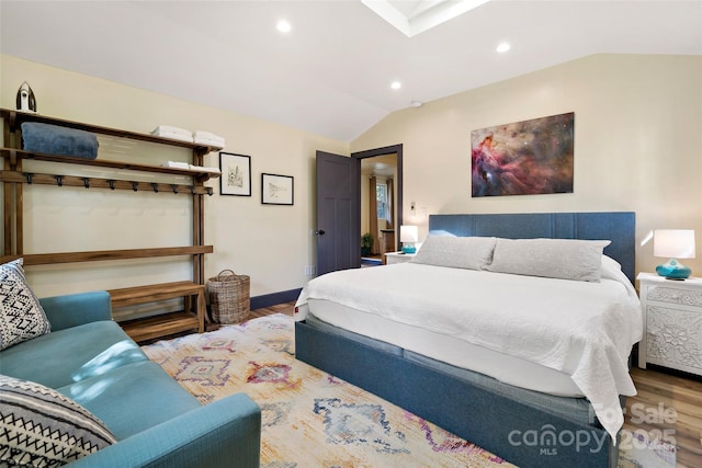 bedroom with recessed lighting, baseboards, wood finished floors, and lofted ceiling