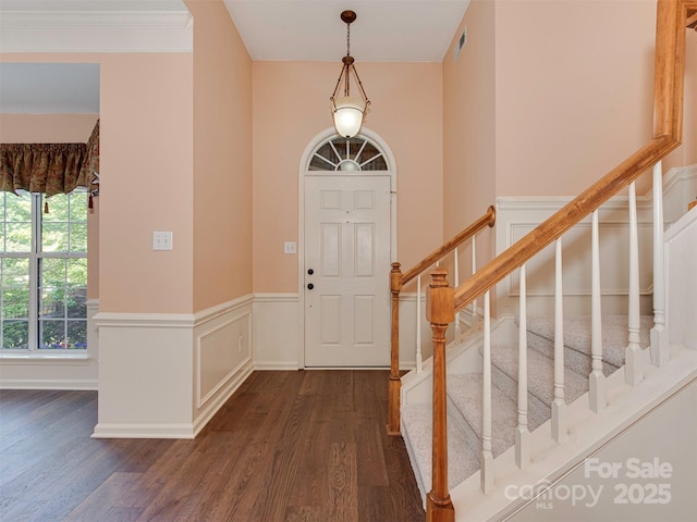2825 Redfield Dr, Charlotte, NC 28270 - entrance foyer featuring dark wood finished floors, stairs, and a wainscoted wall