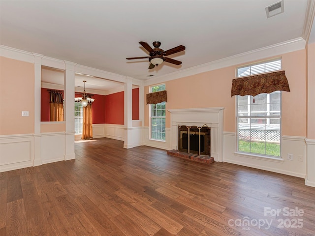 2825 Redfield Dr, Charlotte, NC 28270 - unfurnished living room with wood finished floors, crown molding, ceiling fan, a chandelier, and wainscoting
