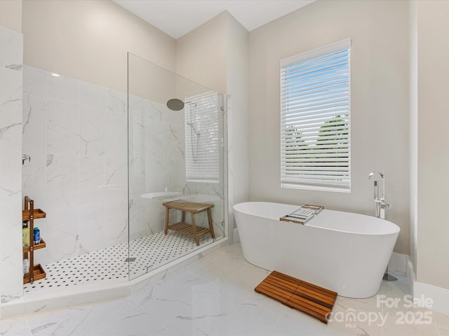 4315 Hartis Grove Church Rd, Indian Trail, NC 28079 - bathroom featuring a freestanding bath, a marble finish shower, and marble finish flooring