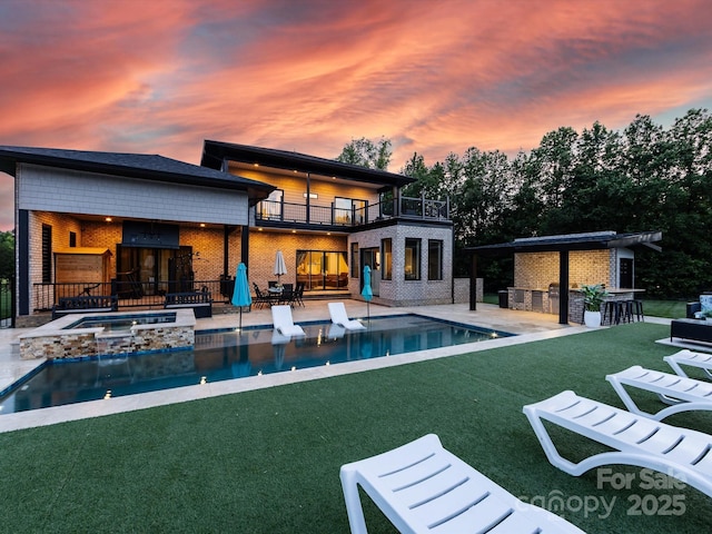4315 Hartis Grove Church Rd, Indian Trail, NC 28079 - back of house with a patio, a yard, a balcony, brick siding, and a pool with connected hot tub