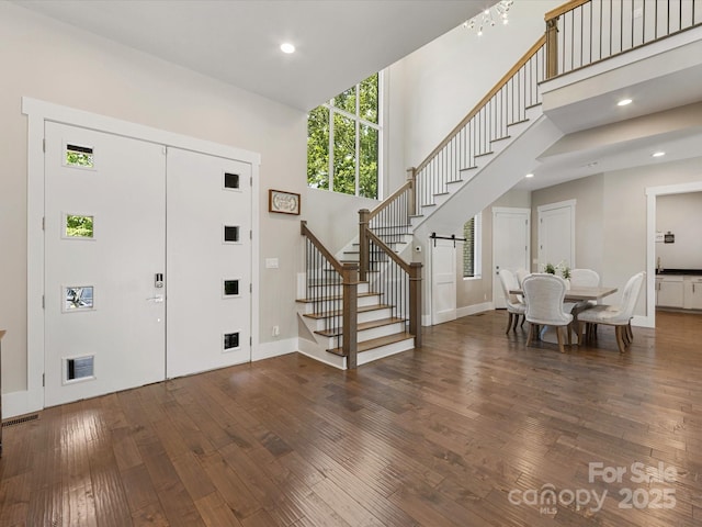 4315 Hartis Grove Church Rd, Indian Trail, NC 28079 - foyer with stairs, hardwood / wood-style floors, a high ceiling, recessed lighting, and a barn door