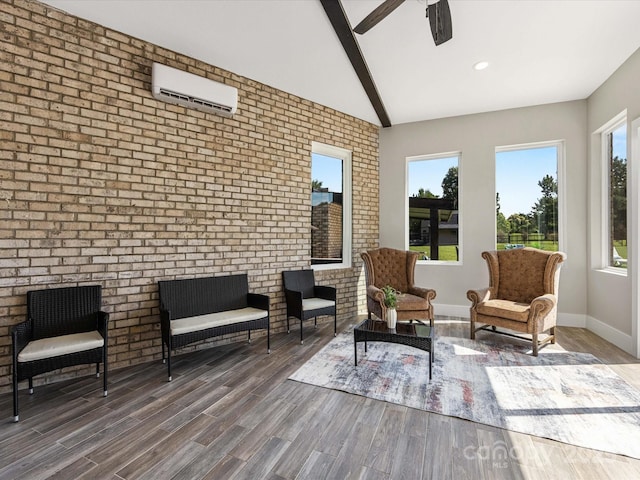 4315 Hartis Grove Church Rd, Indian Trail, NC 28079 - living area with a wall mounted AC, wood finished floors, brick wall, a ceiling fan, and recessed lighting