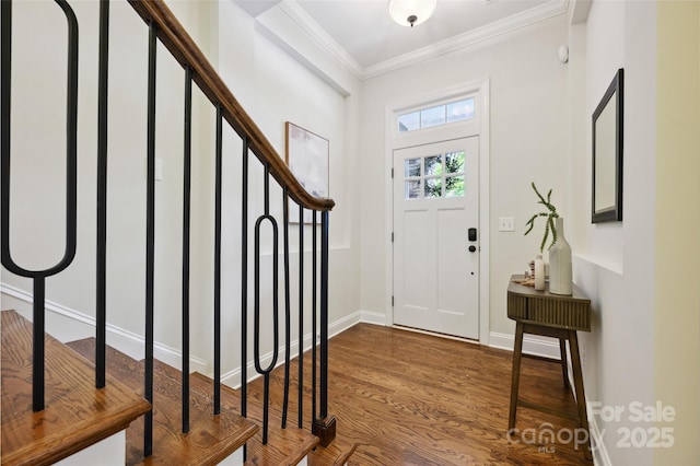 entryway featuring crown molding, stairway, wood finished floors, and baseboards
