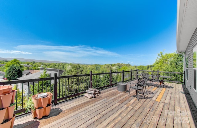 wooden terrace featuring a mountain view