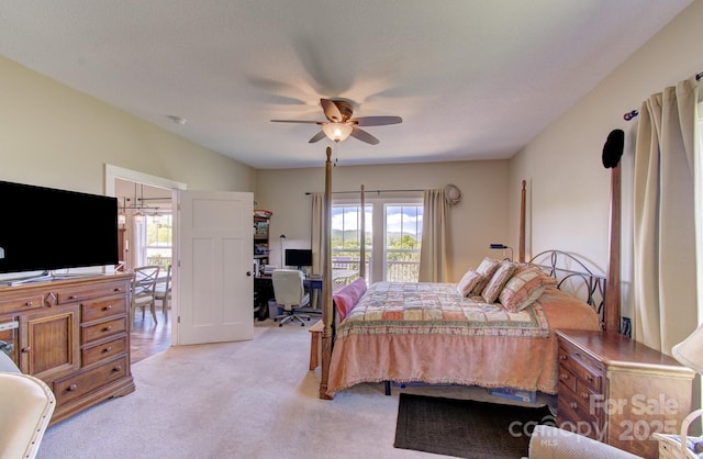 bedroom with a ceiling fan and light carpet