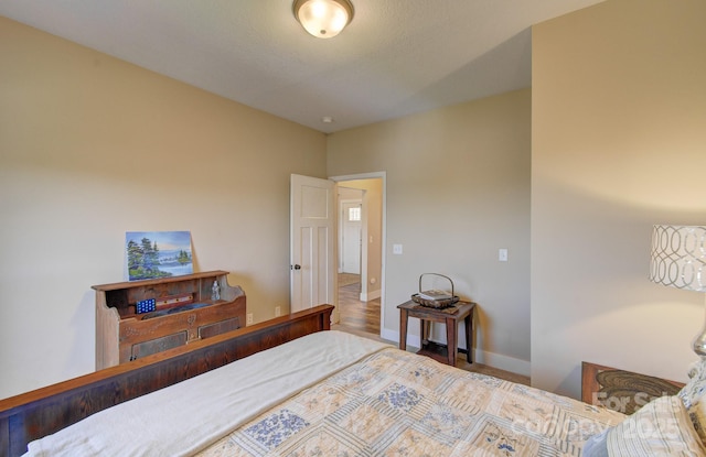 bedroom featuring baseboards