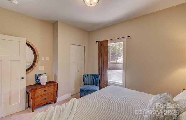 bedroom featuring carpet floors and baseboards