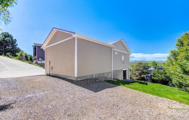 view of home's exterior with driveway