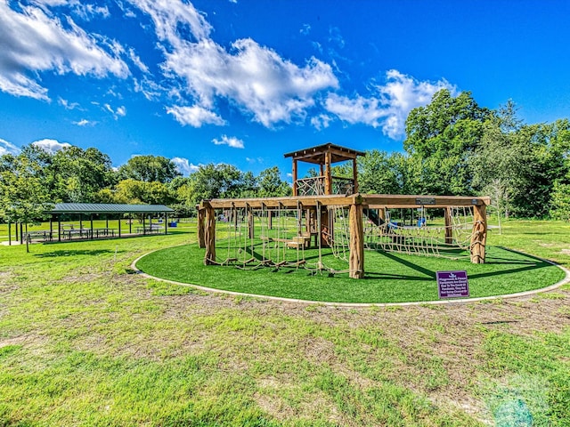 communal playground featuring a yard