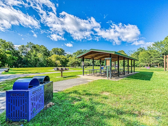 view of property's community featuring a lawn and a gazebo