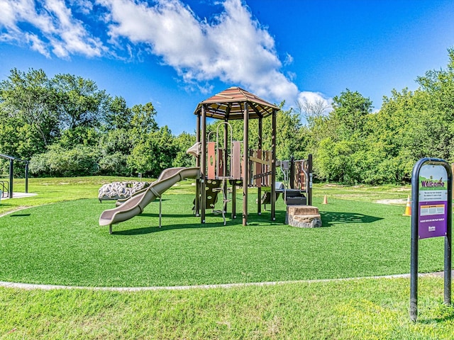 community play area with a lawn