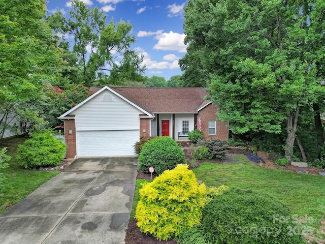 ranch-style house with brick siding, an attached garage, concrete driveway, and a front lawn