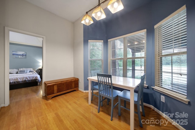 dining room with light wood-type flooring and baseboards