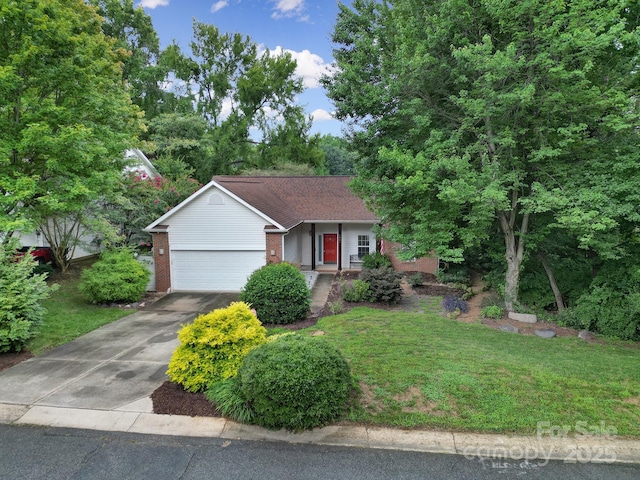 view of front of home featuring brick siding, an attached garage, driveway, and a front yard