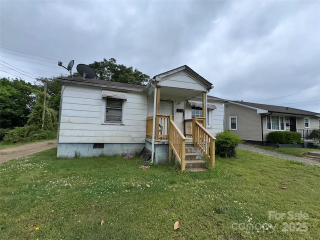 302 Melrose Dr SW, Concord, NC 28025 - view of front facade featuring crawl space and a front yard