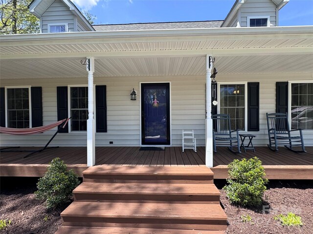entrance to property with covered porch