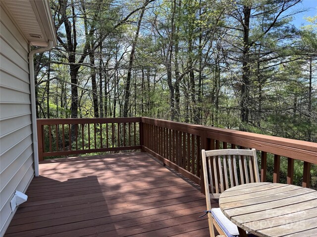 deck with outdoor dining area