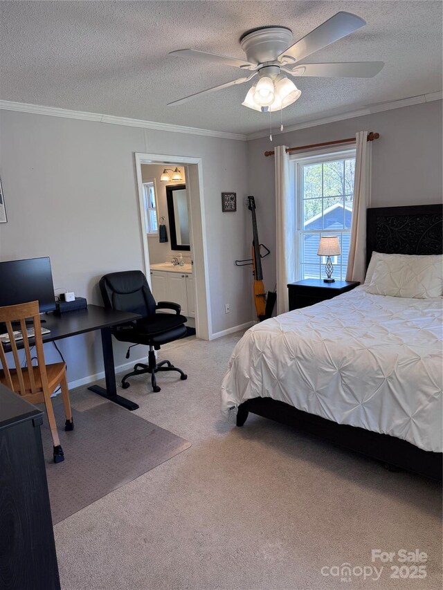 bedroom featuring a textured ceiling, light colored carpet, crown molding, baseboards, and connected bathroom