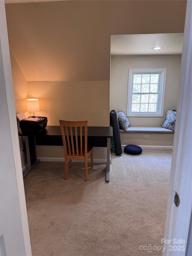 office with baseboards and carpet
