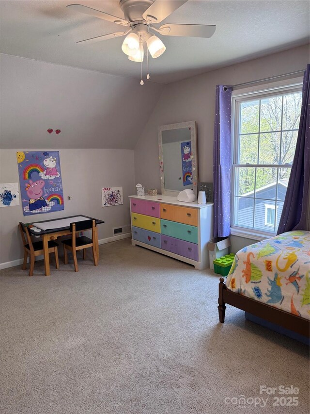 carpeted bedroom with baseboards, a ceiling fan, and lofted ceiling