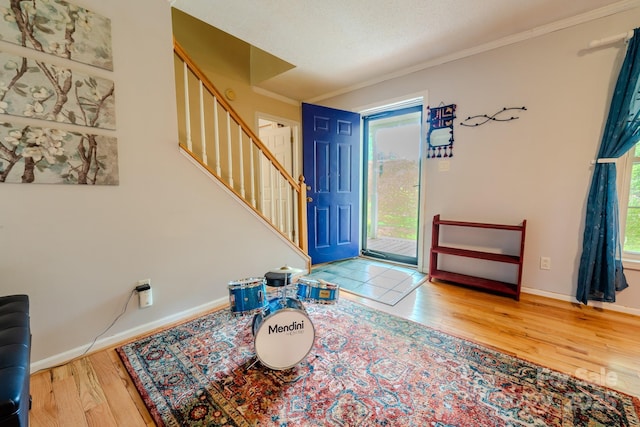 76 Overlook Pointe Dr, Spruce Pine, NC 28777 - foyer entrance featuring wood finished floors, stairs, ornamental molding, and baseboards