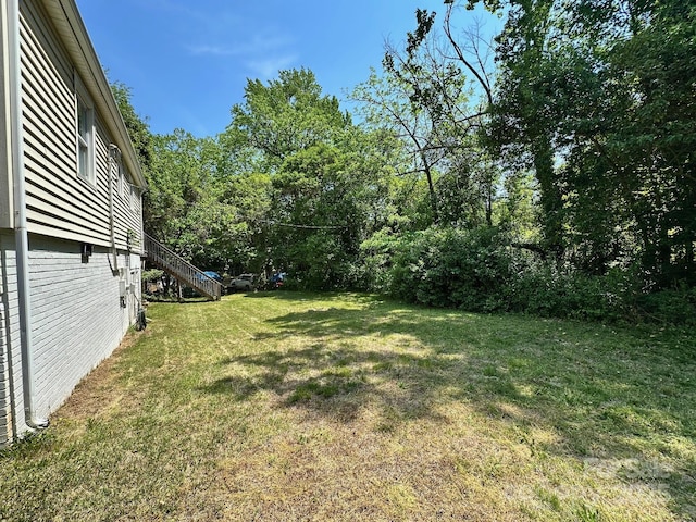 view of yard featuring stairs