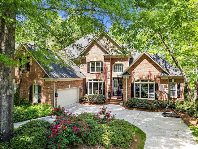 11510 Pine Valley Club Dr, Charlotte, NC 28277 - traditional-style home featuring brick siding, an attached garage, driveway, and roof with shingles
