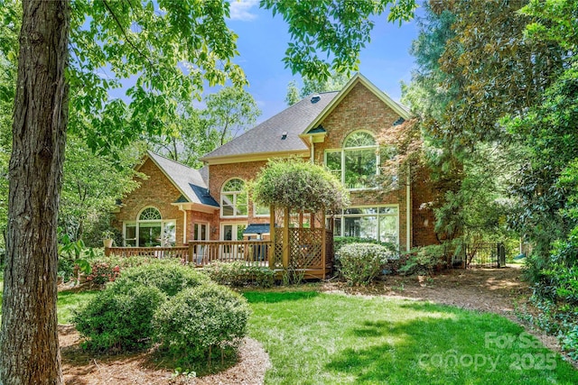 11510 Pine Valley Club Dr, Charlotte, NC 28277 - back of property featuring a yard, brick siding, a wooden deck, and roof with shingles