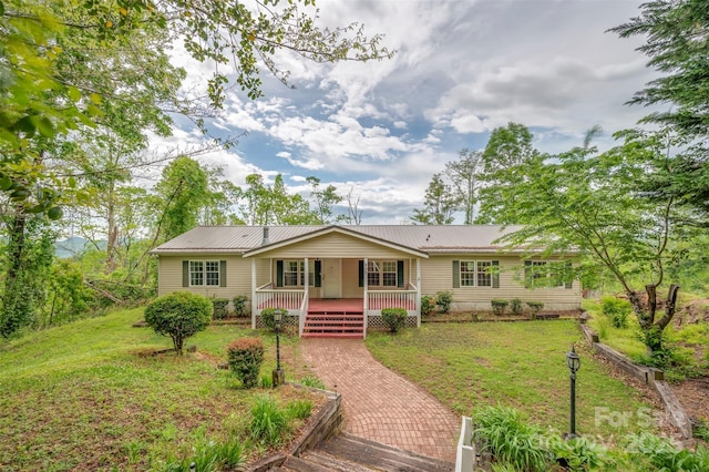 257 River Crest Dr, Flat Rock, NC 28731 - view of front of property featuring metal roof, a porch, and a front yard
