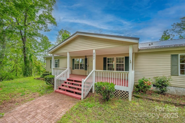 257 River Crest Dr, Flat Rock, NC 28731 - bungalow-style home with metal roof and a porch