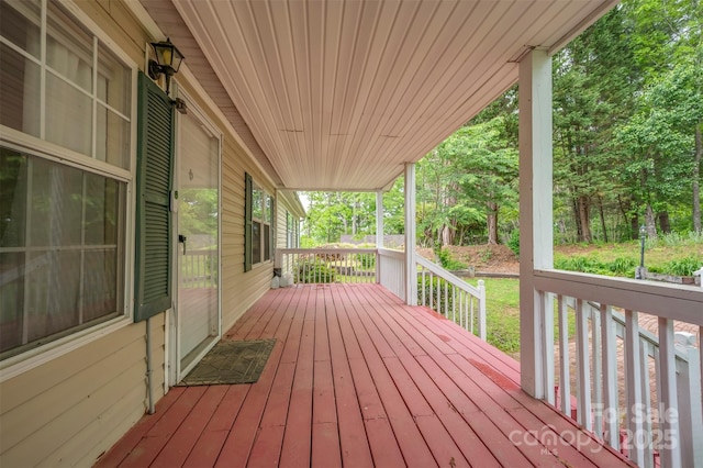 257 River Crest Dr, Flat Rock, NC 28731 - wooden terrace featuring covered porch